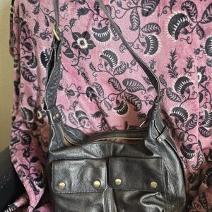 Not Rational Black Leather Shoulder Bag with Gold Accents